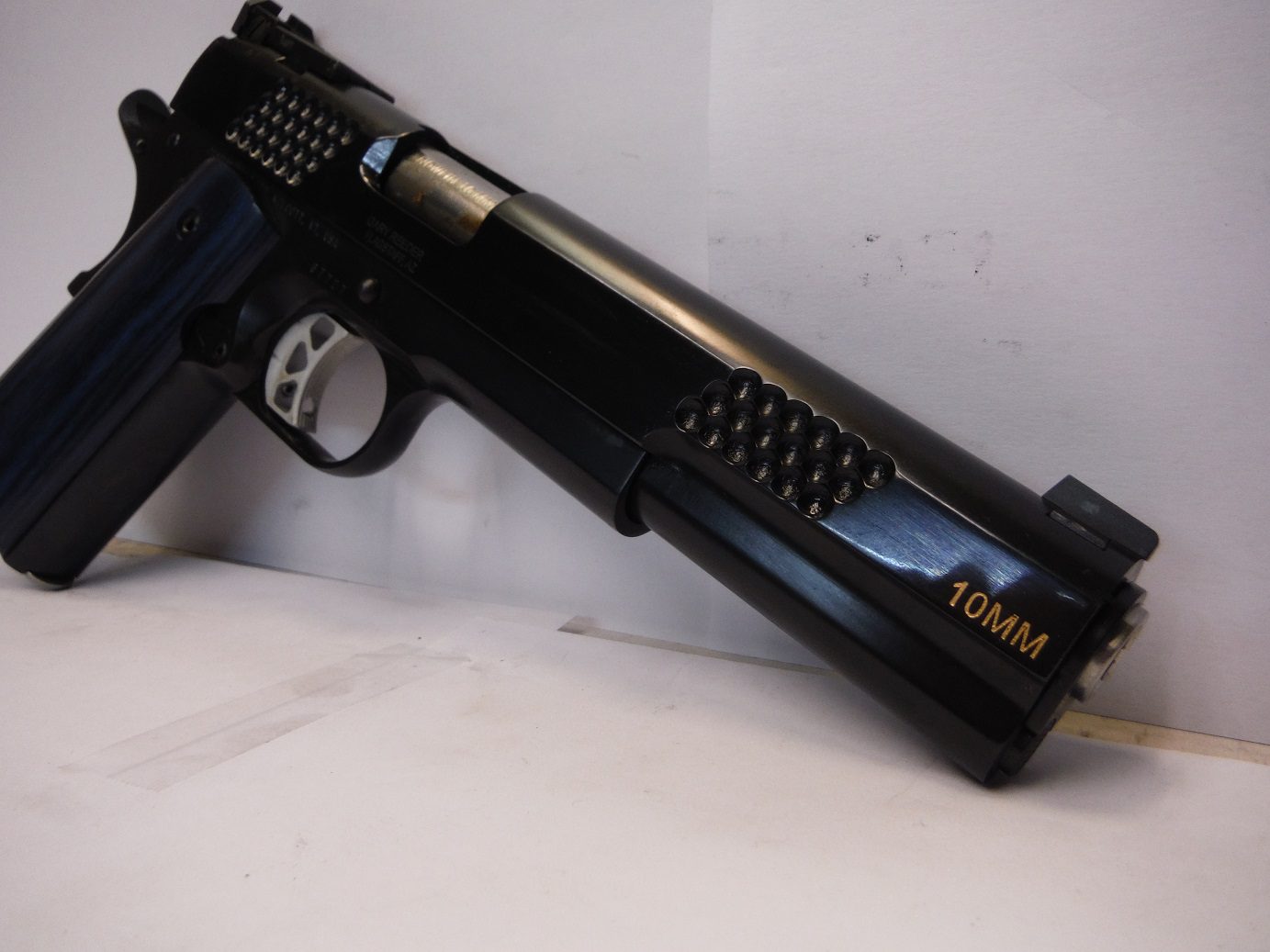 A gun that is sitting on top of the table.
