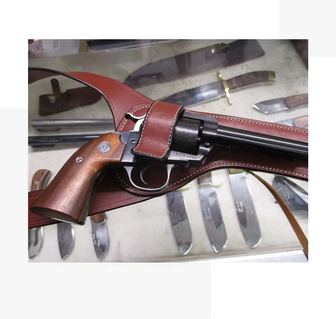 11 (1) A gun that is sitting on some sort of table.