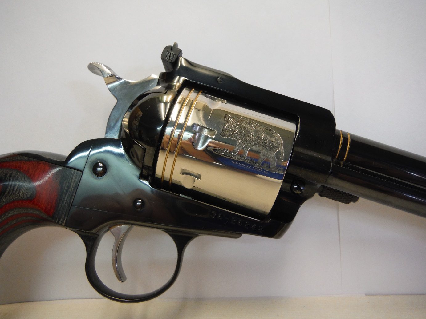 A gun that has been opened to show the barrel.
