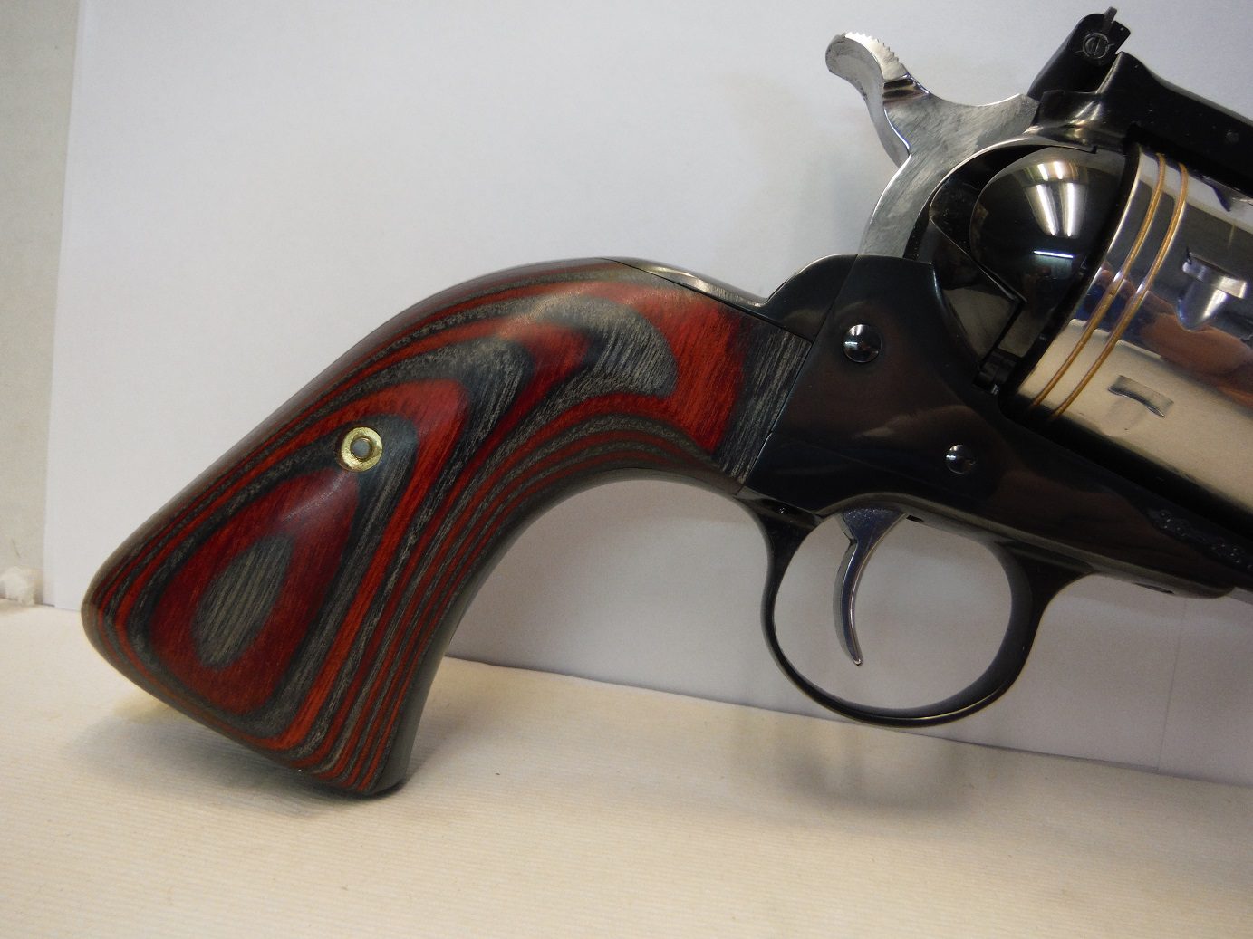 A gun that is leaning against the wall