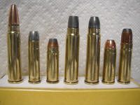 416 GNR_small A row of different types of bullets sitting on top of a table.