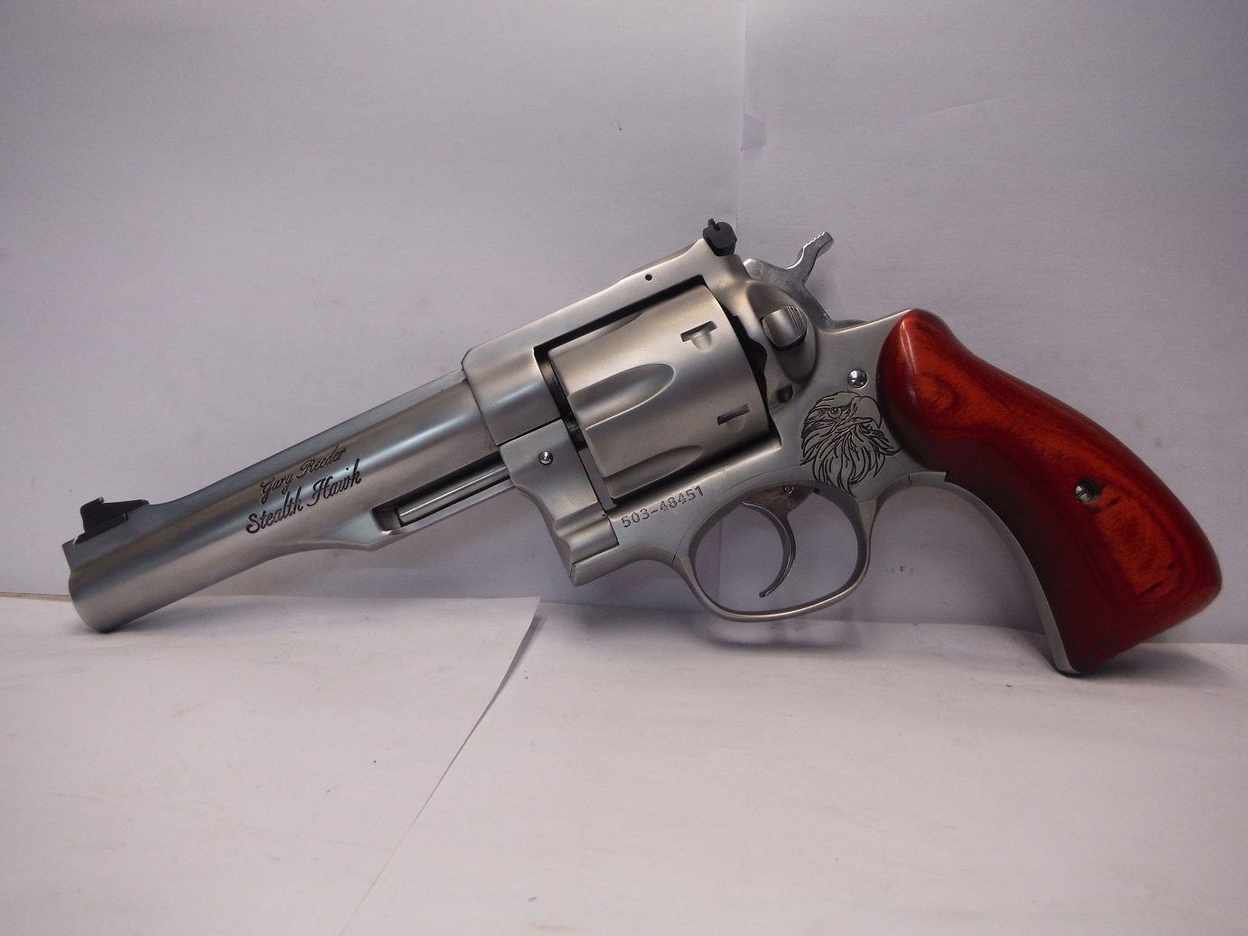 A gun that is sitting on top of a table.