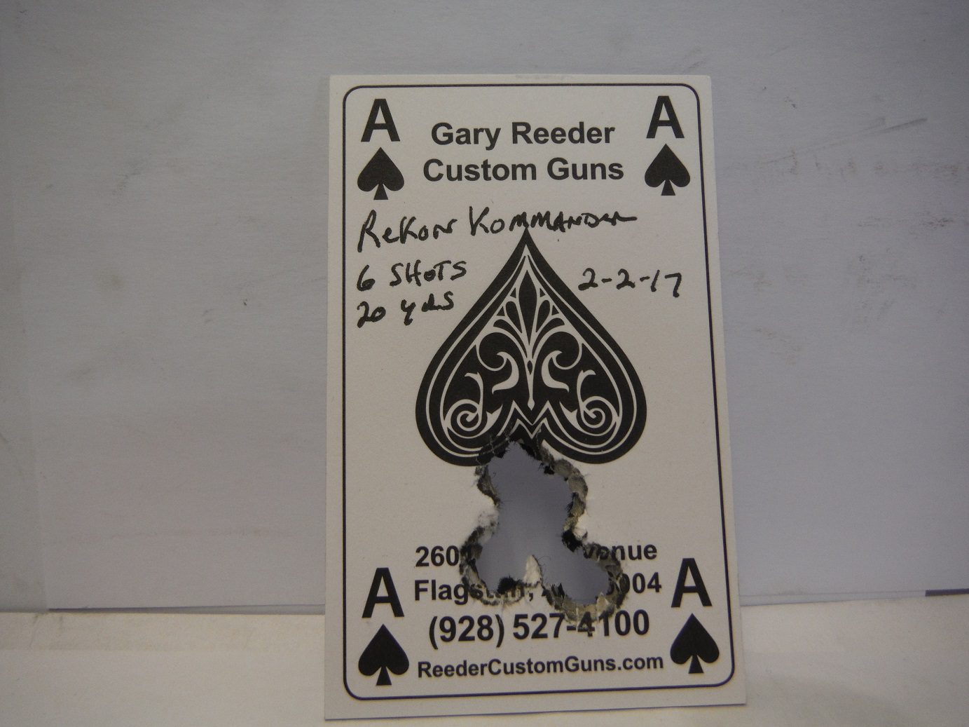 A card with the ace of spades cut out.