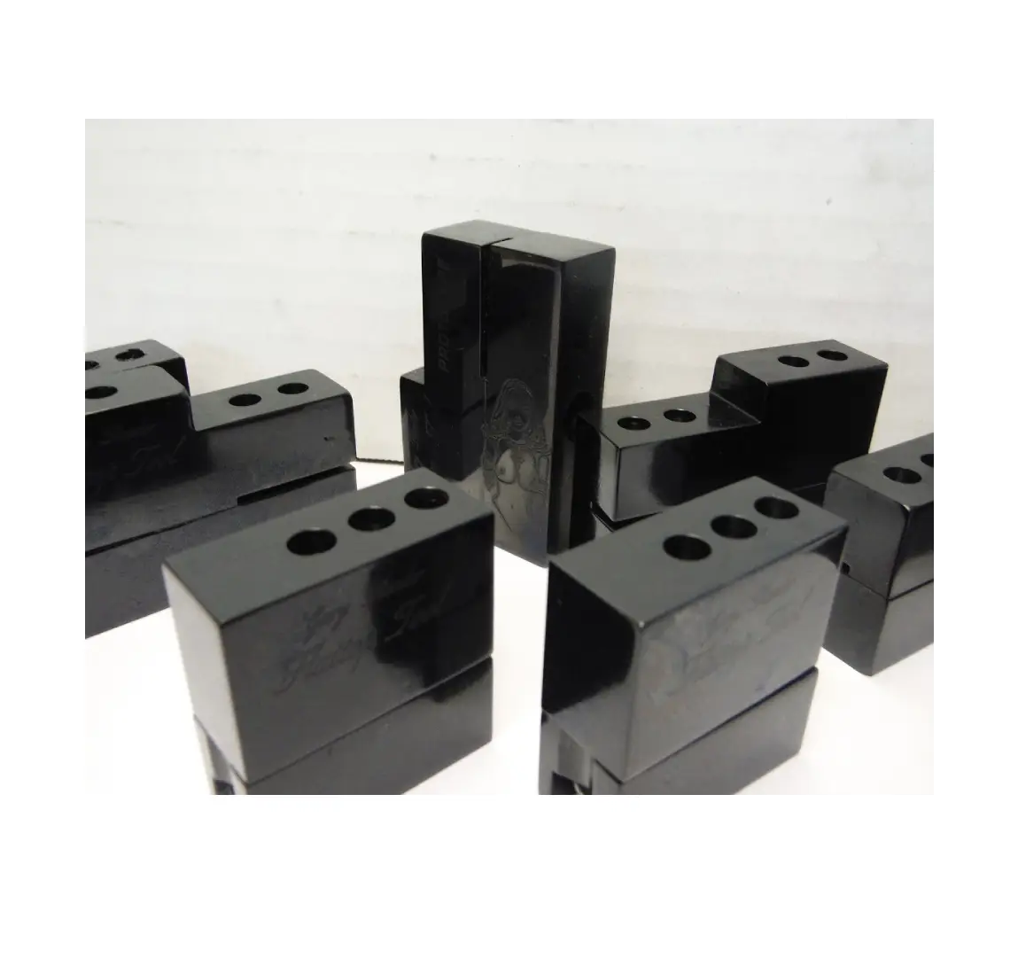 5 A group of black blocks sitting on top of each other.