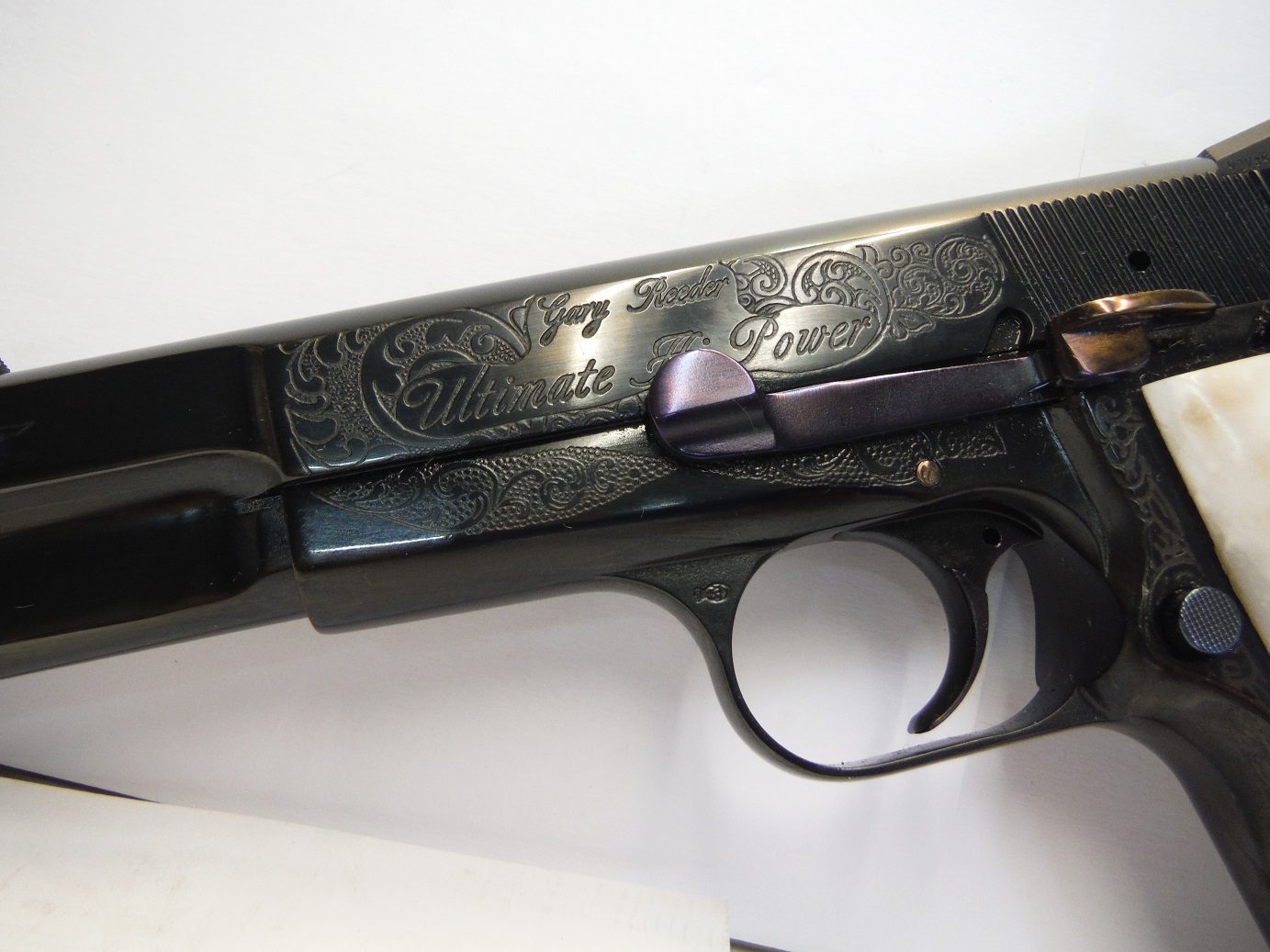 A close up of the side of a gun