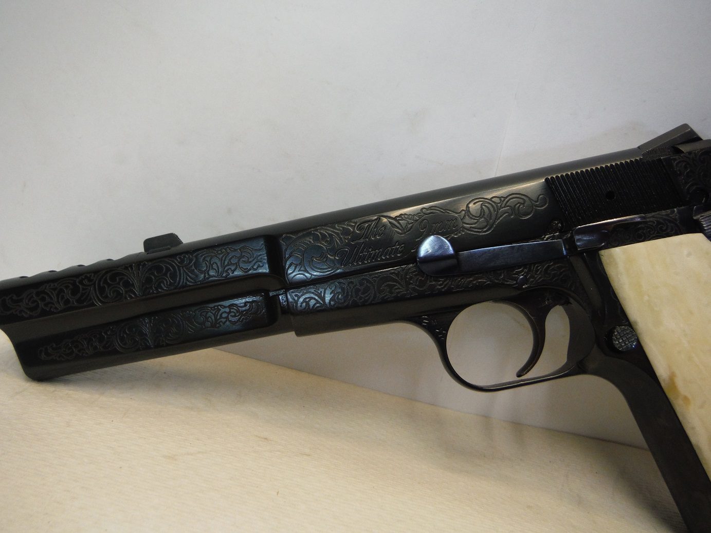 A close up of the side of an old gun.