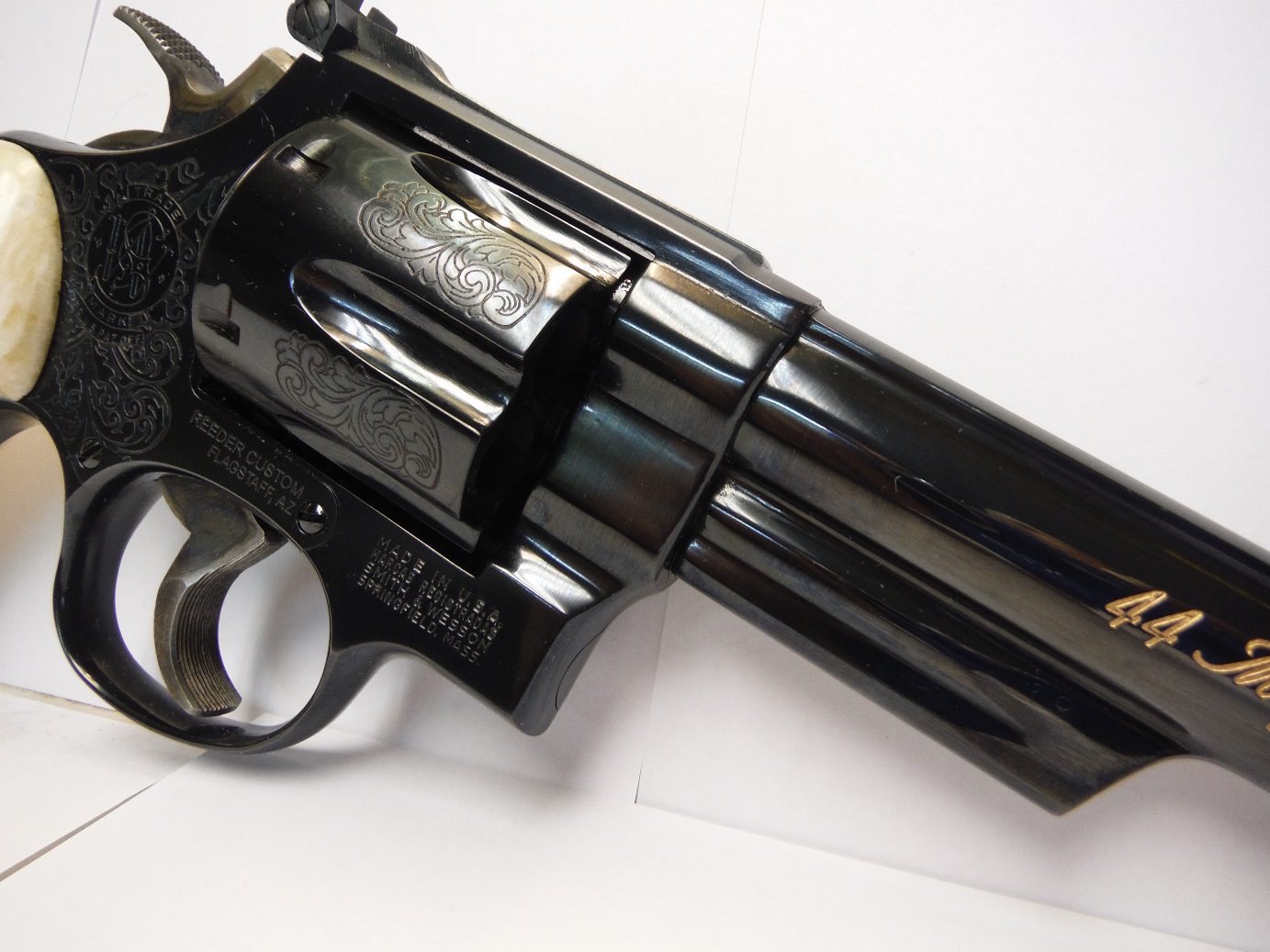 A gun that is sitting on top of a table.