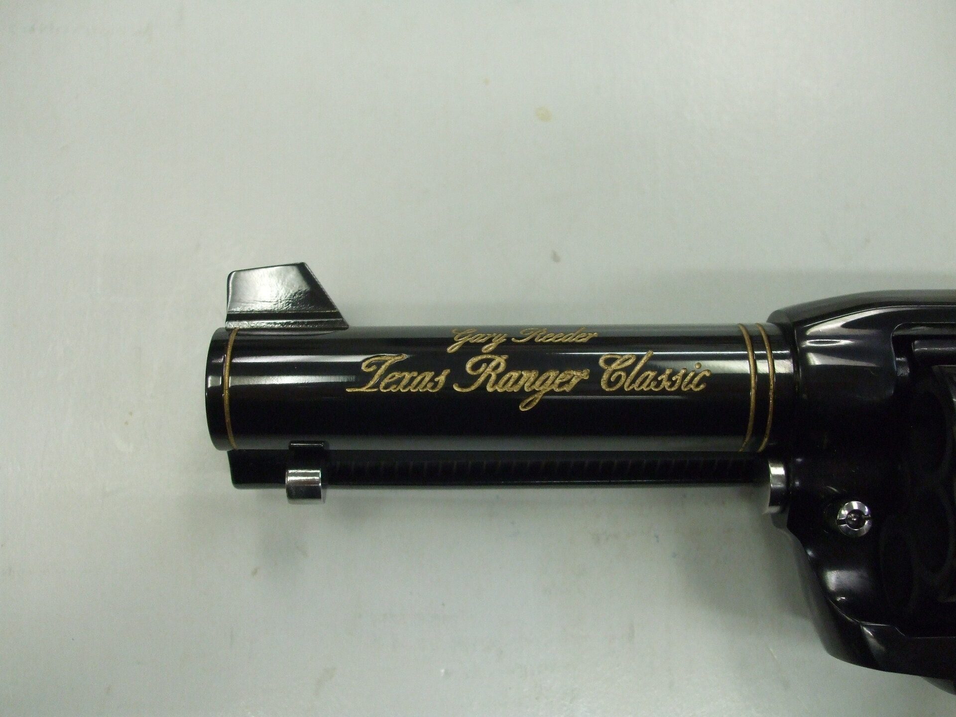 A close up of the side of a gun