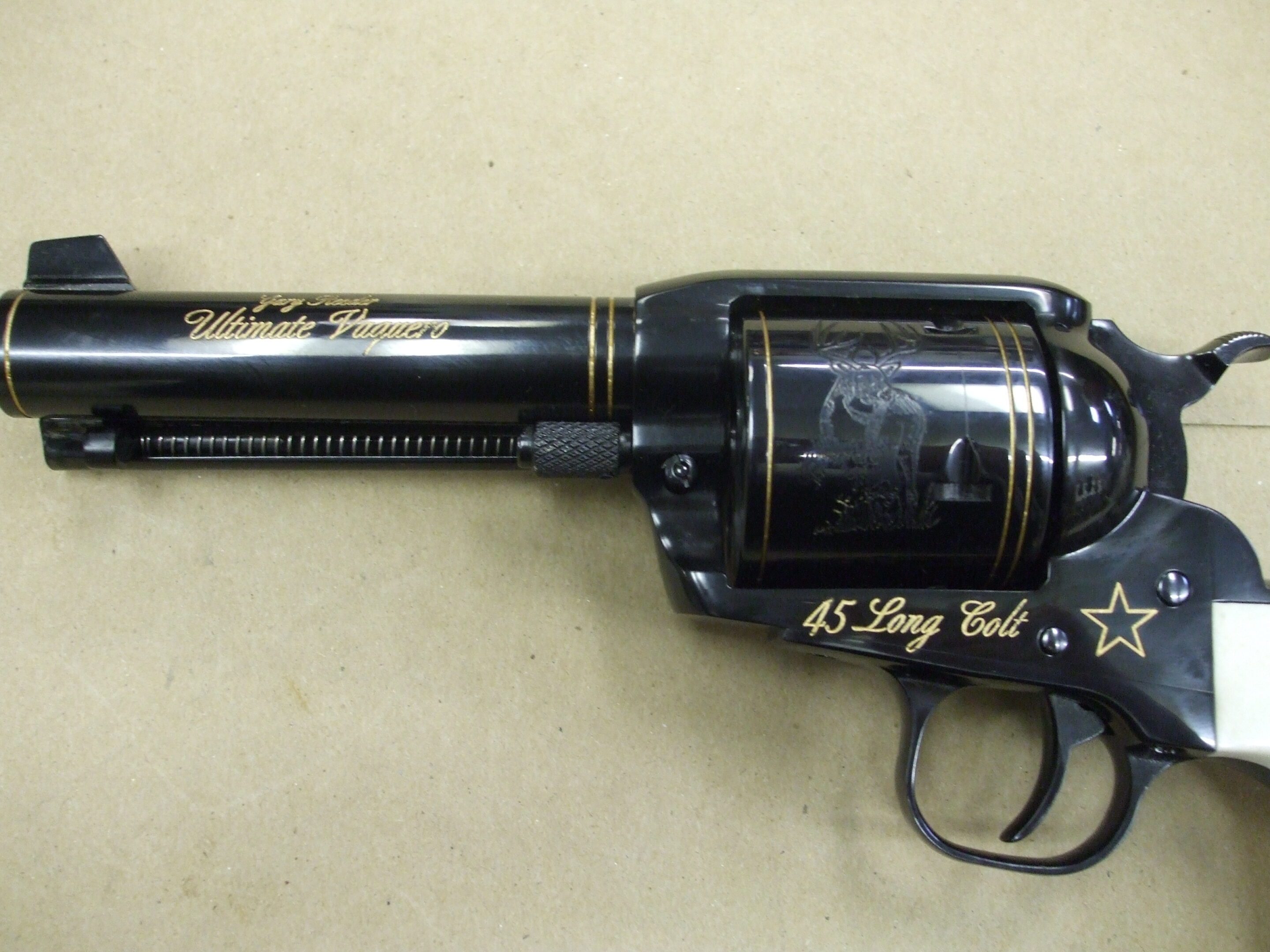 A black and gold gun with the words " us navy seal team six ".