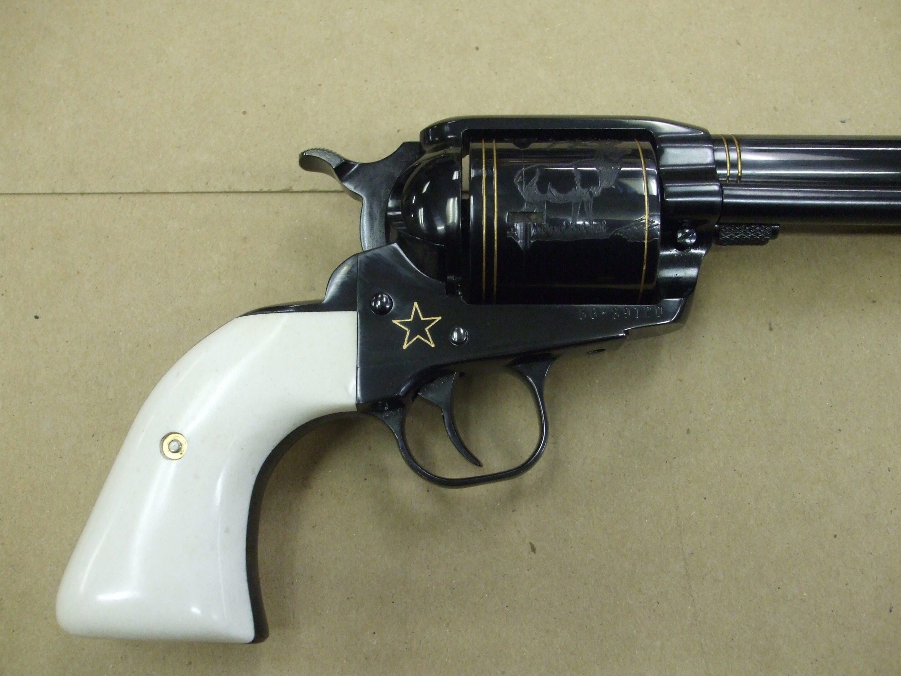 A black and white gun with a star on it.