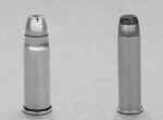 Gary_a_small A bullet and a shell are shown side by side.