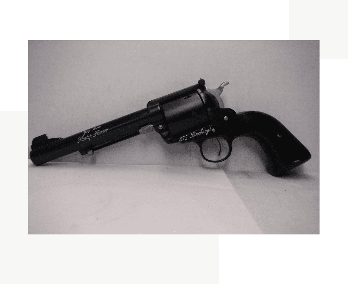 Group 14 A black gun is sitting on the floor