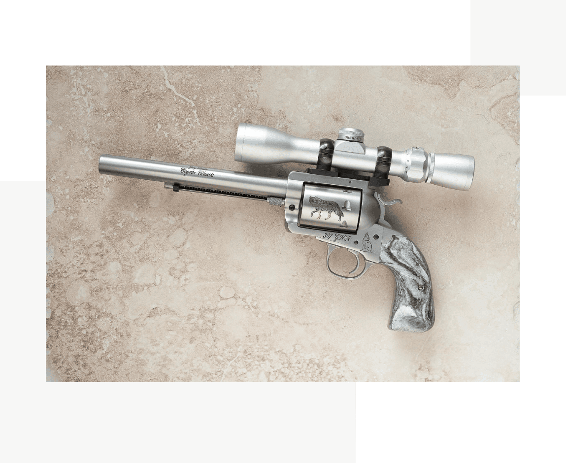 Group 26 A gun with a scope on it's side.