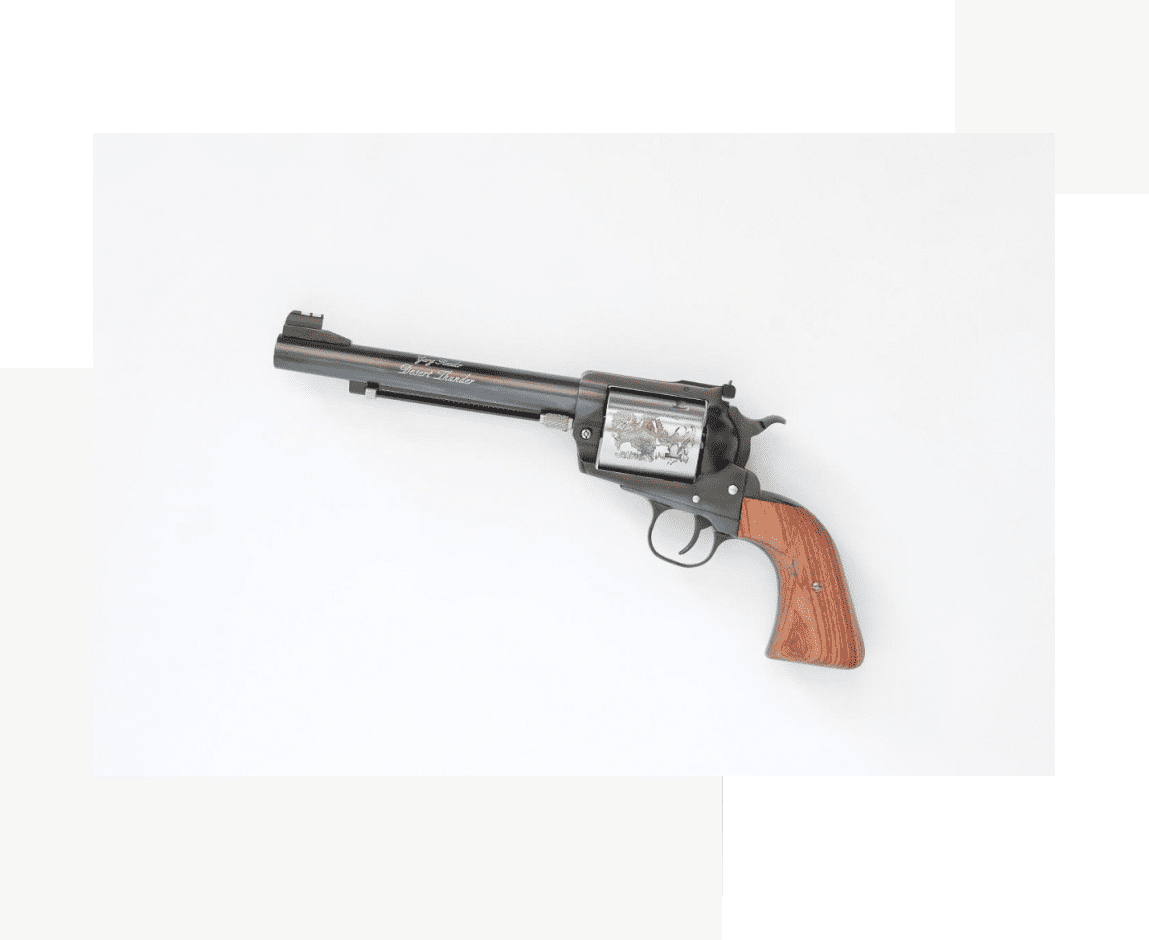 Group 28 A gun with a wooden handle and a picture on the side of it.