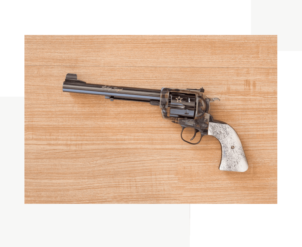 Group 34 A gun that is on top of a table.