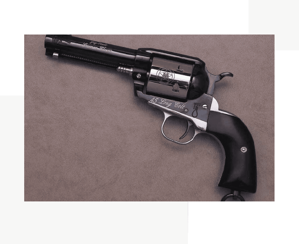 Group 40 A gun that is on the ground with its barrel pointed up.