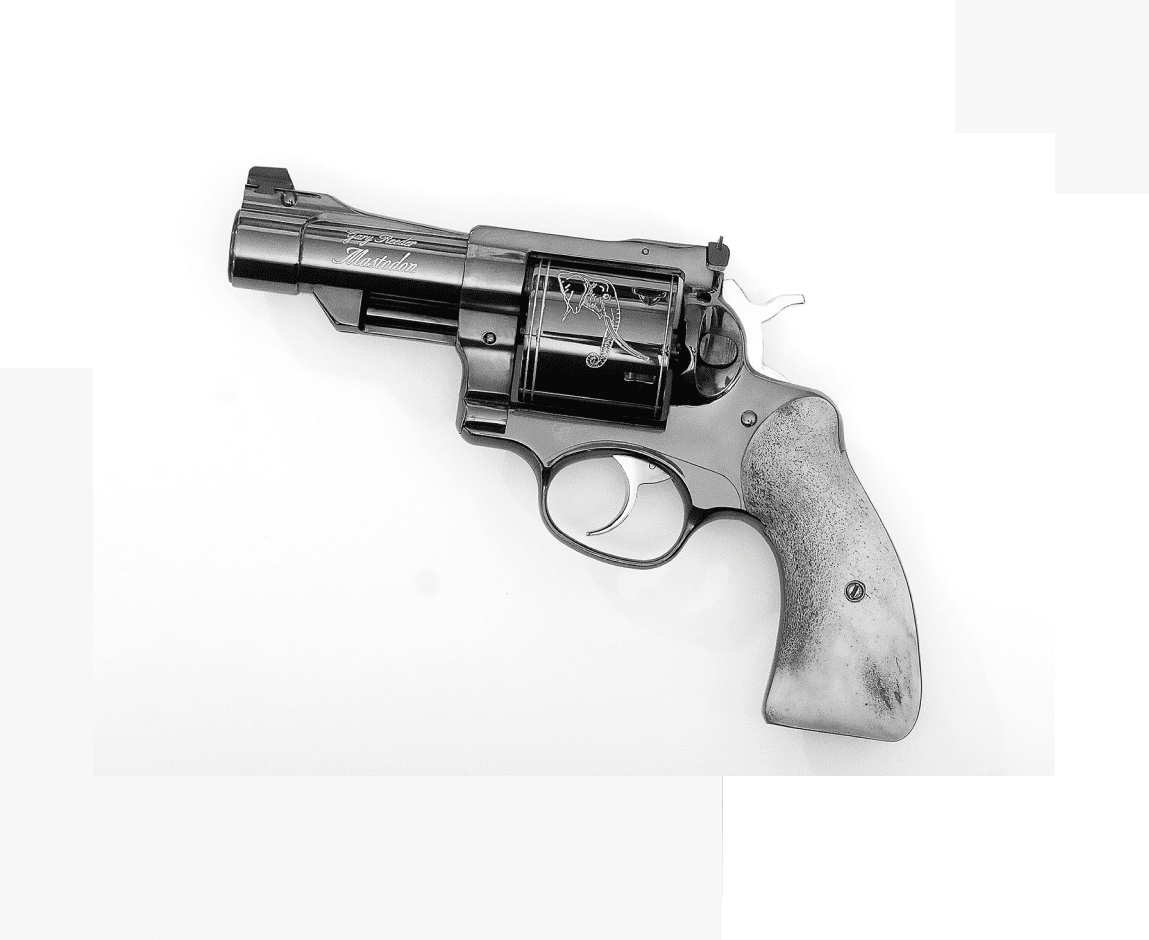 Group 43 A gun that is sitting on the ground.