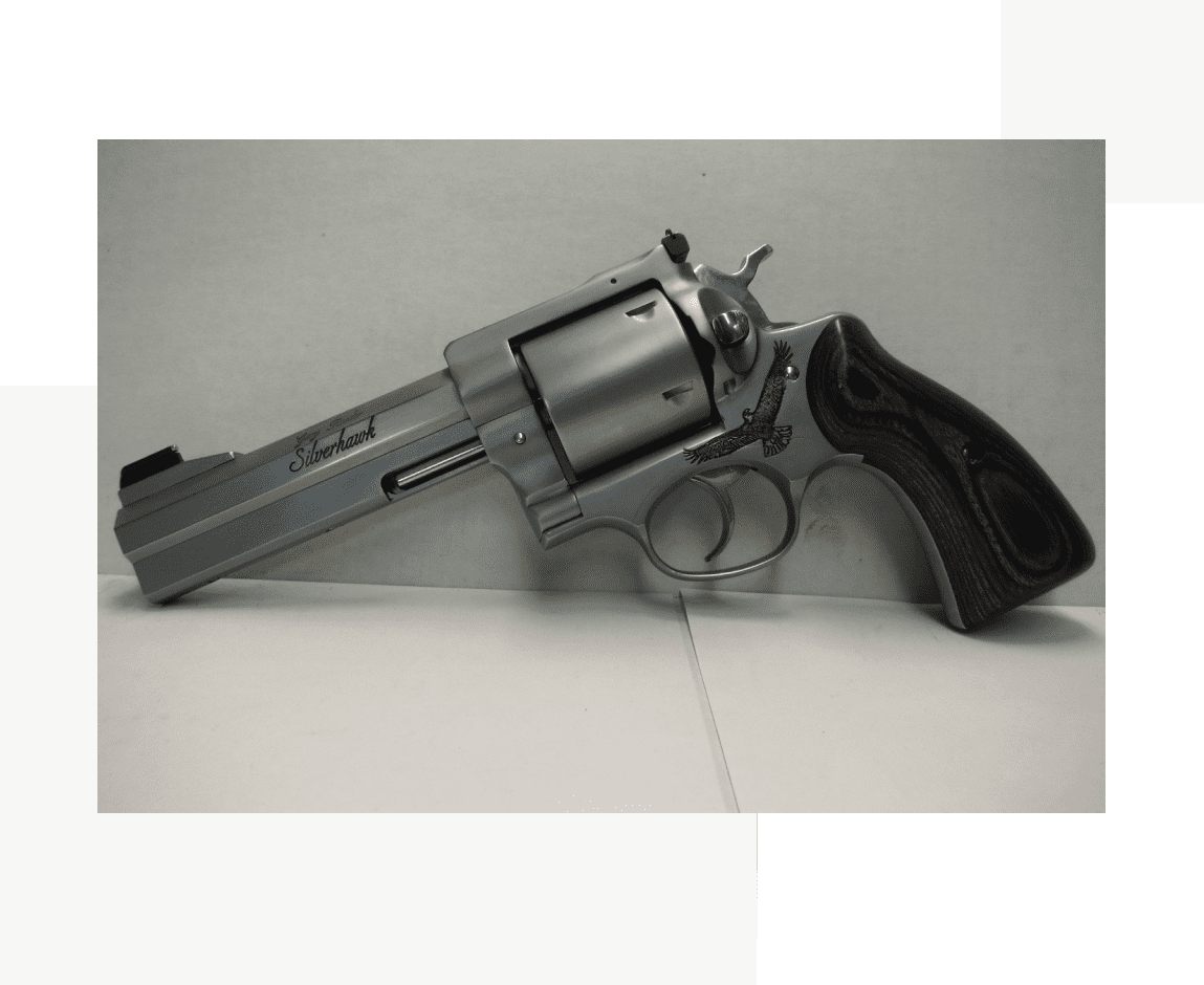 Group 52 A gun that is sitting on the ground.