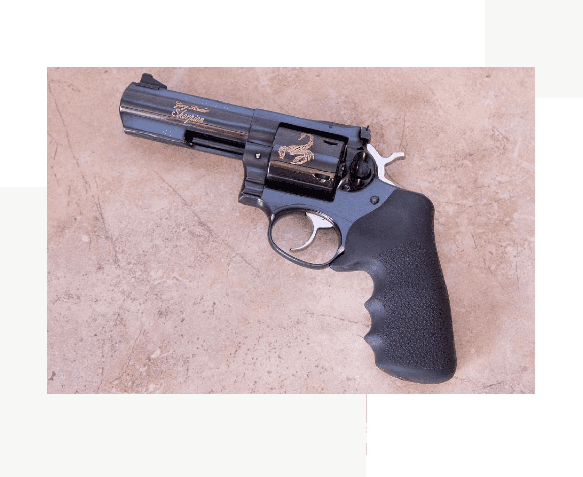 A black revolver with a rubber grip on the side.