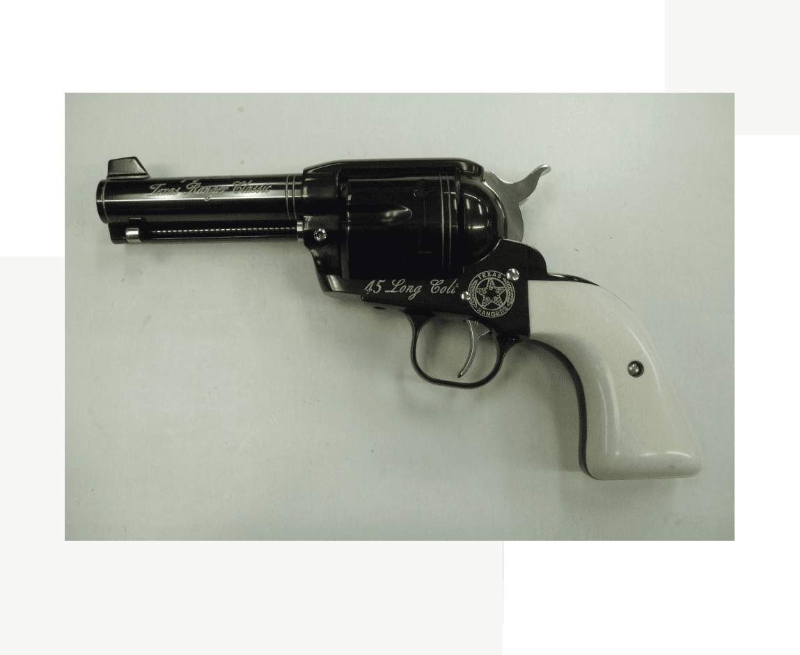 Group 58 A black and white gun is on the wall