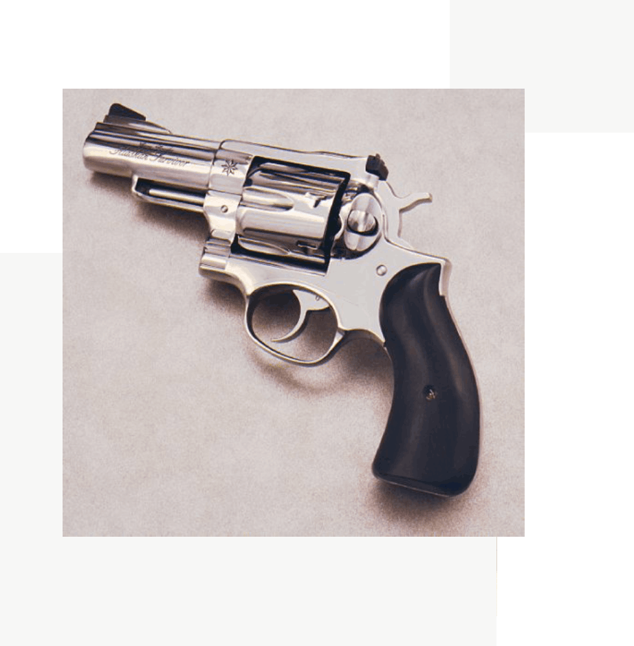 Group 60 A gun that is sitting on the ground.