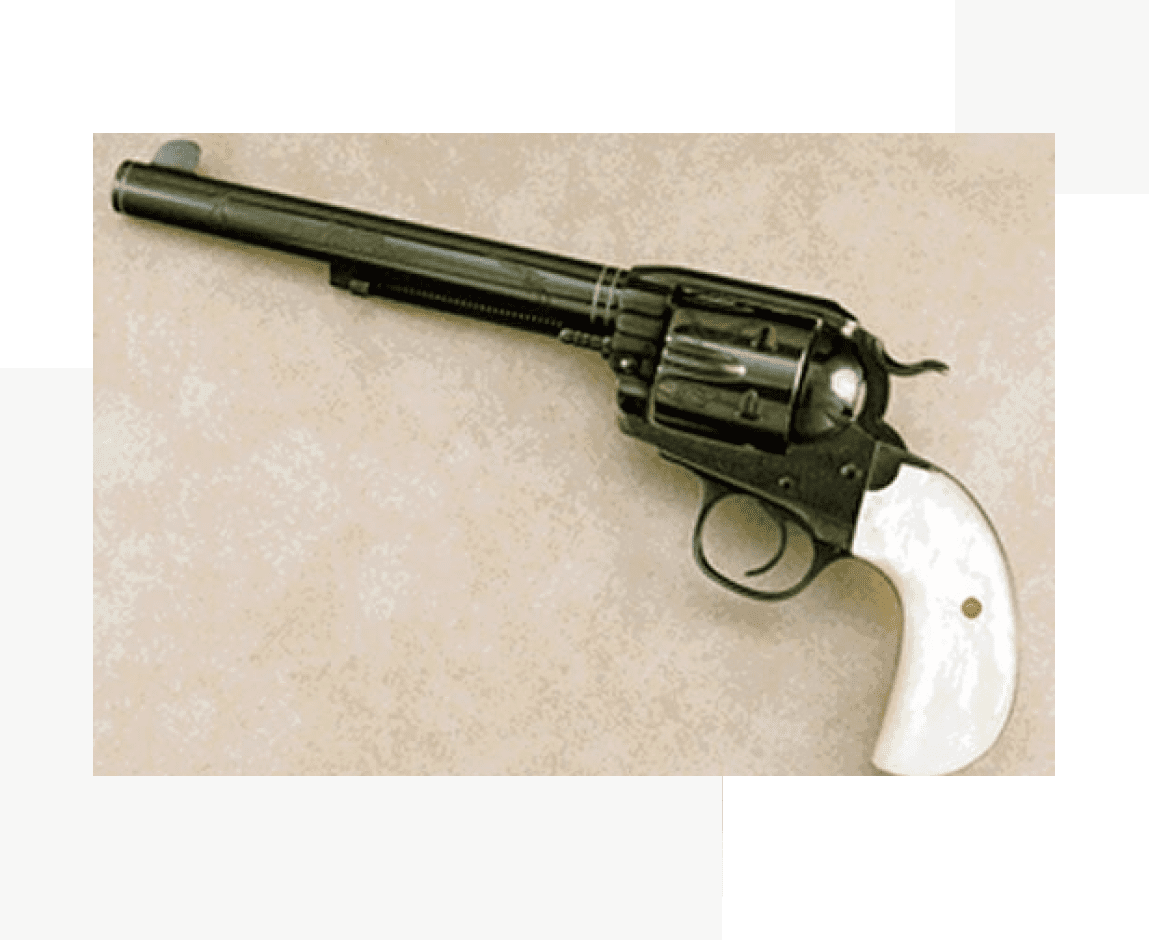 Group 68 A black and white gun is on the ground