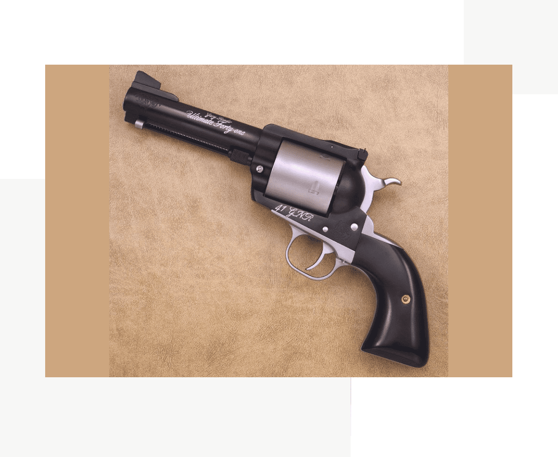 Group 70 A black and silver gun is laying on the floor