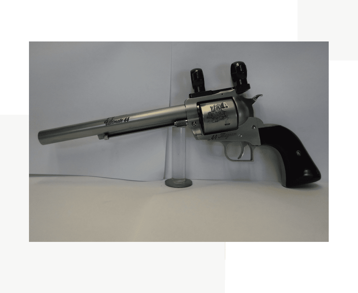 Group 71 A gun that is sitting on the ground.