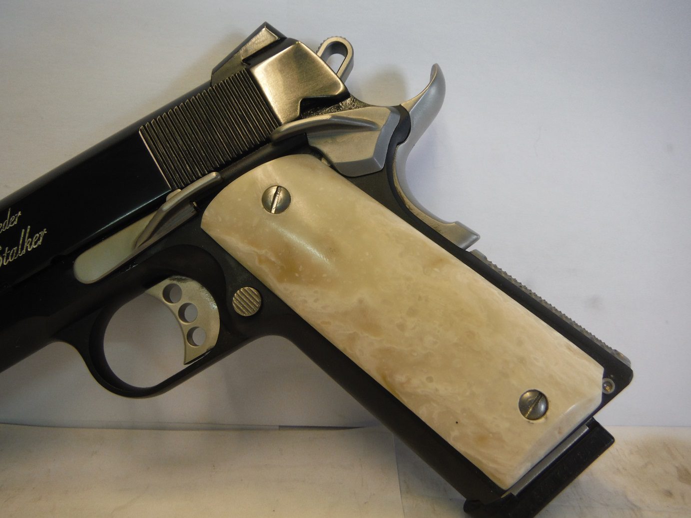 A gun that is sitting on top of a table.