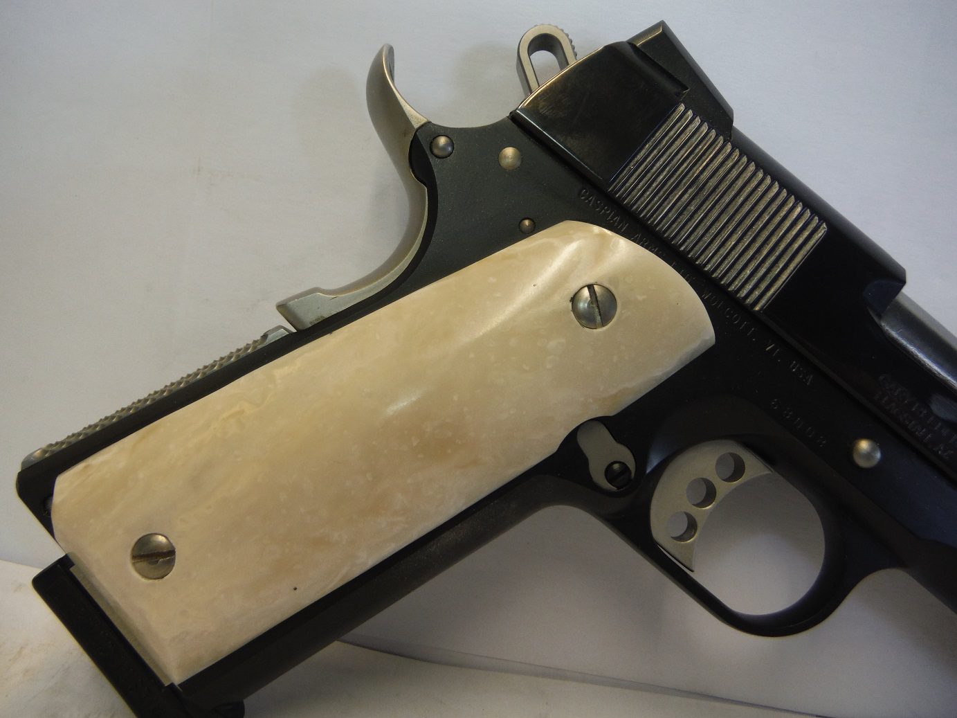 A gun that is laying on the ground.