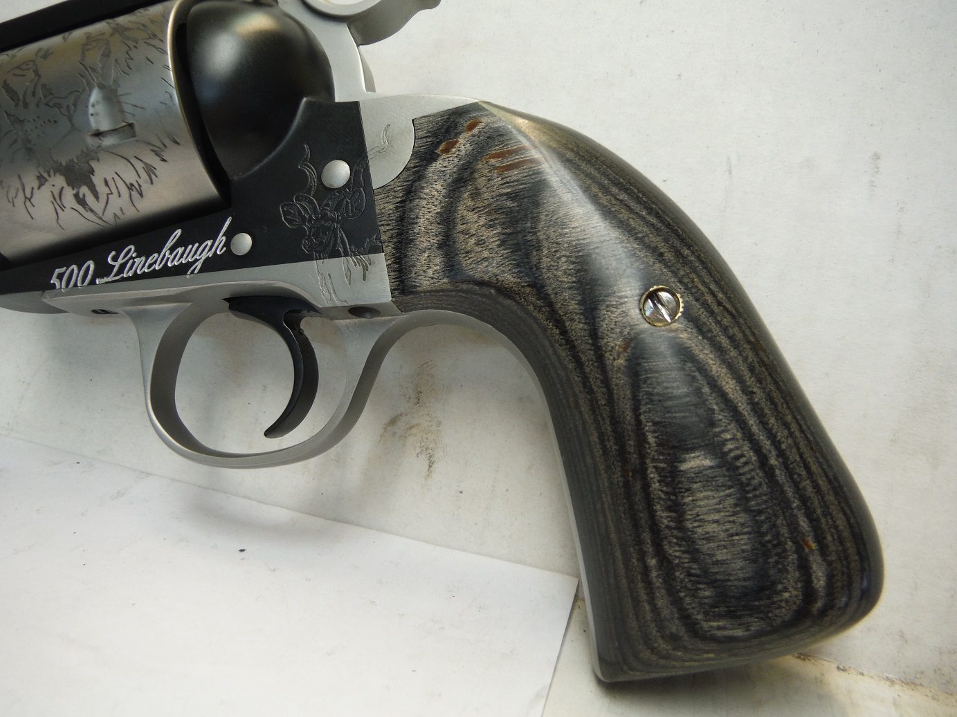 A close up of the side of a gun