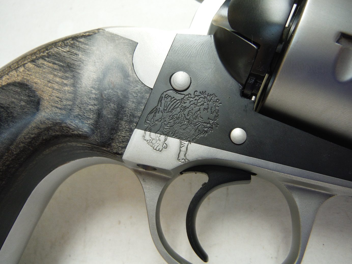 A close up of the handle on a gun