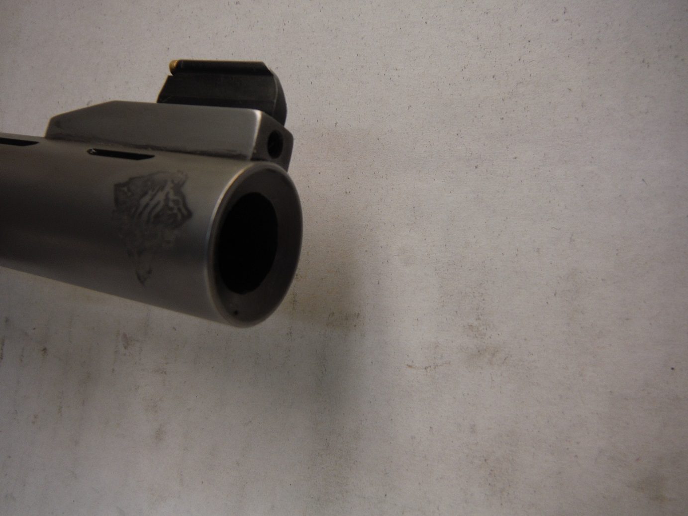 A close up of the barrel on a gun