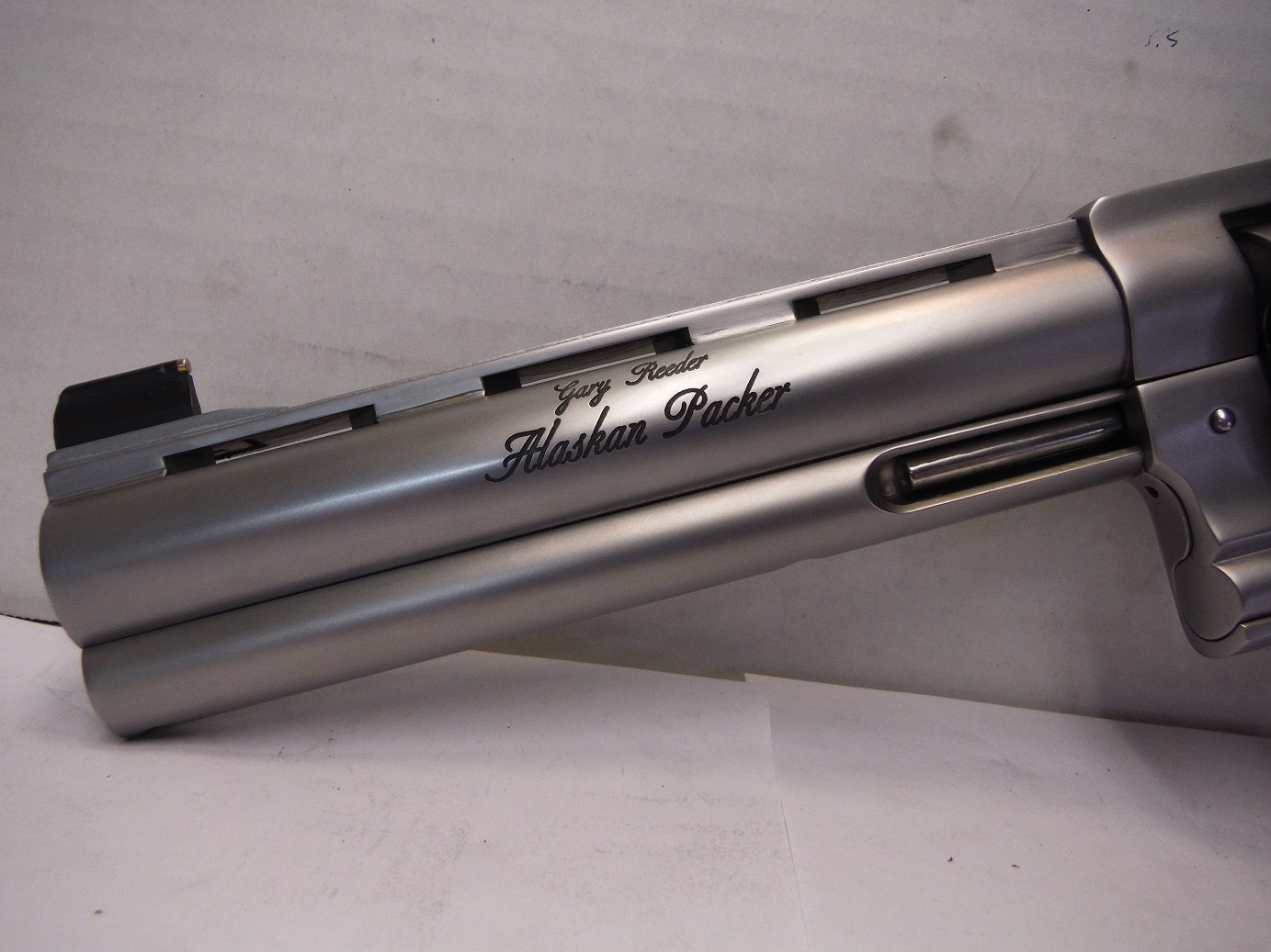 A close up of the side of a gun