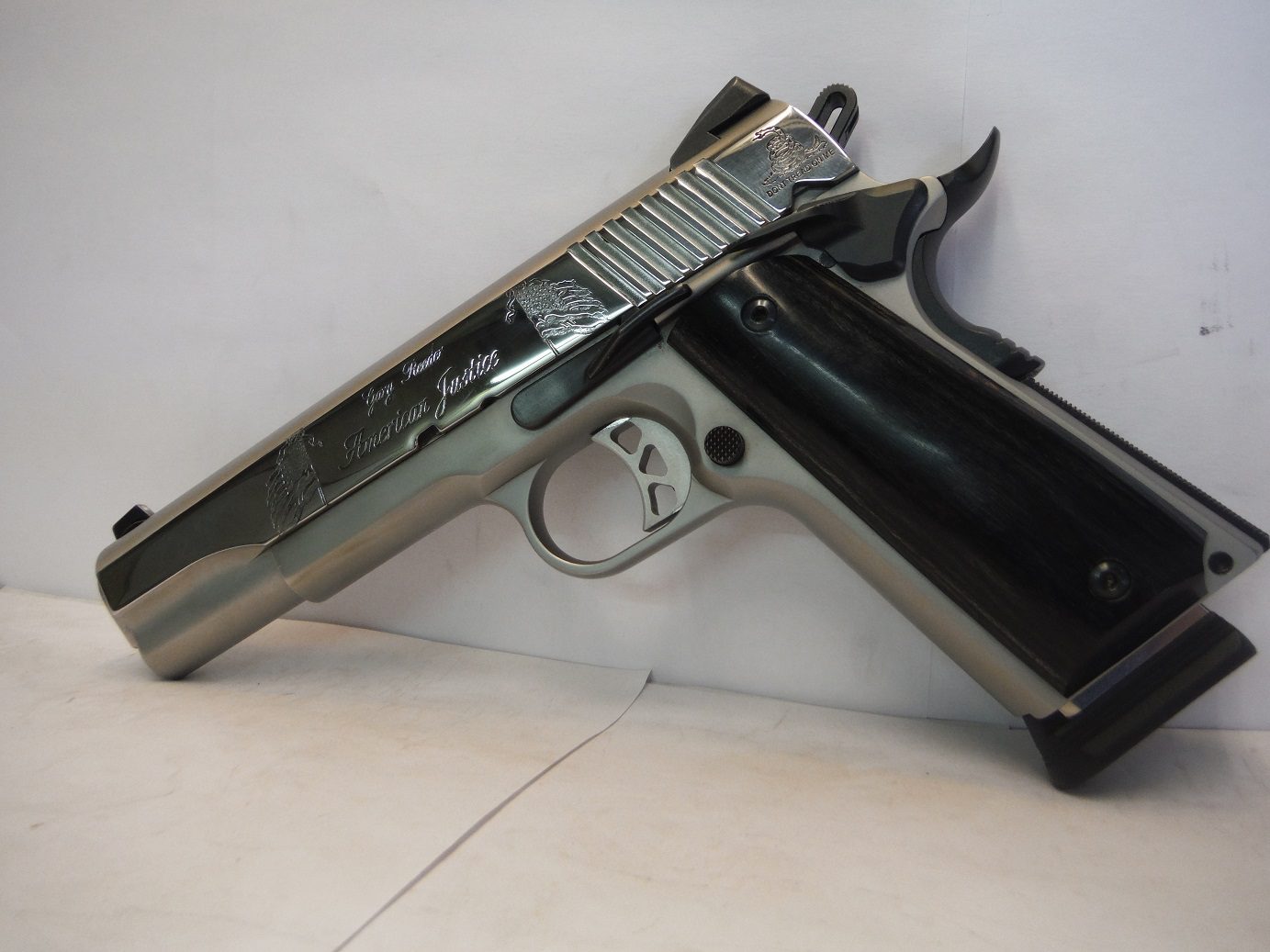 A gun that is laying on the ground.