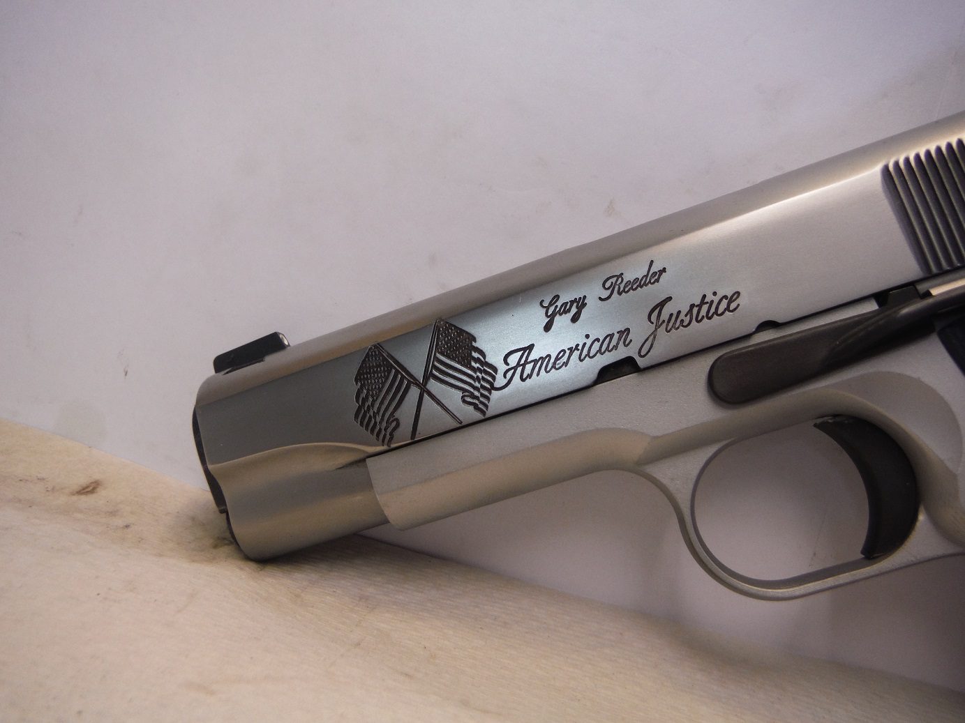 A close up of the side of a gun