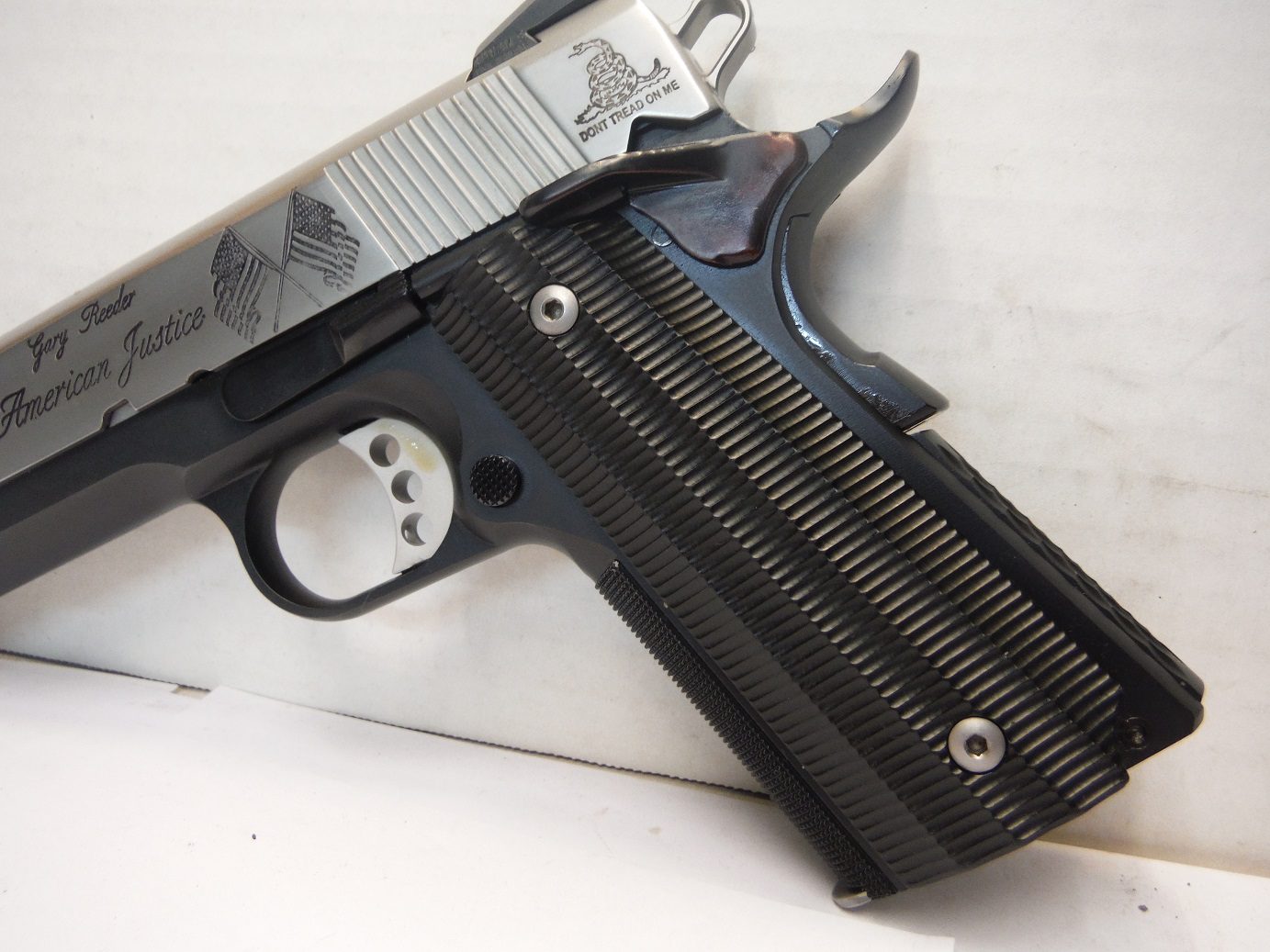 A close up of a gun on top of a table.