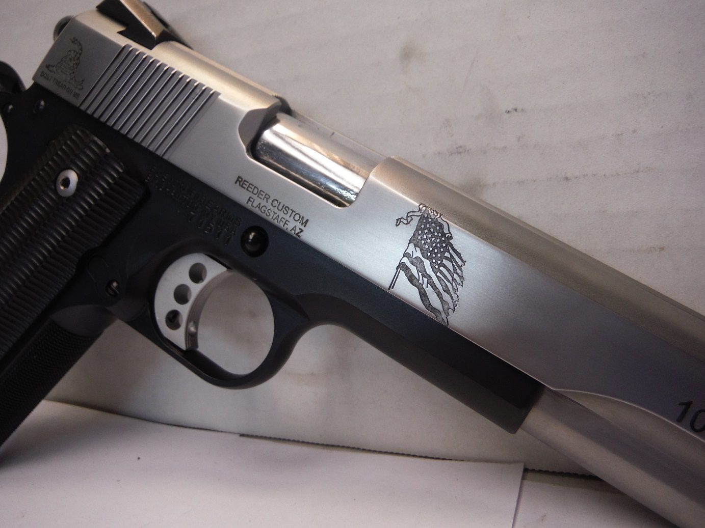 A close up of the side of a gun