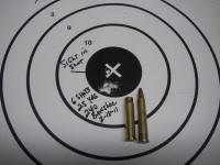 banshee_small A bullet is sitting on the target and two other bullets are in front of it.