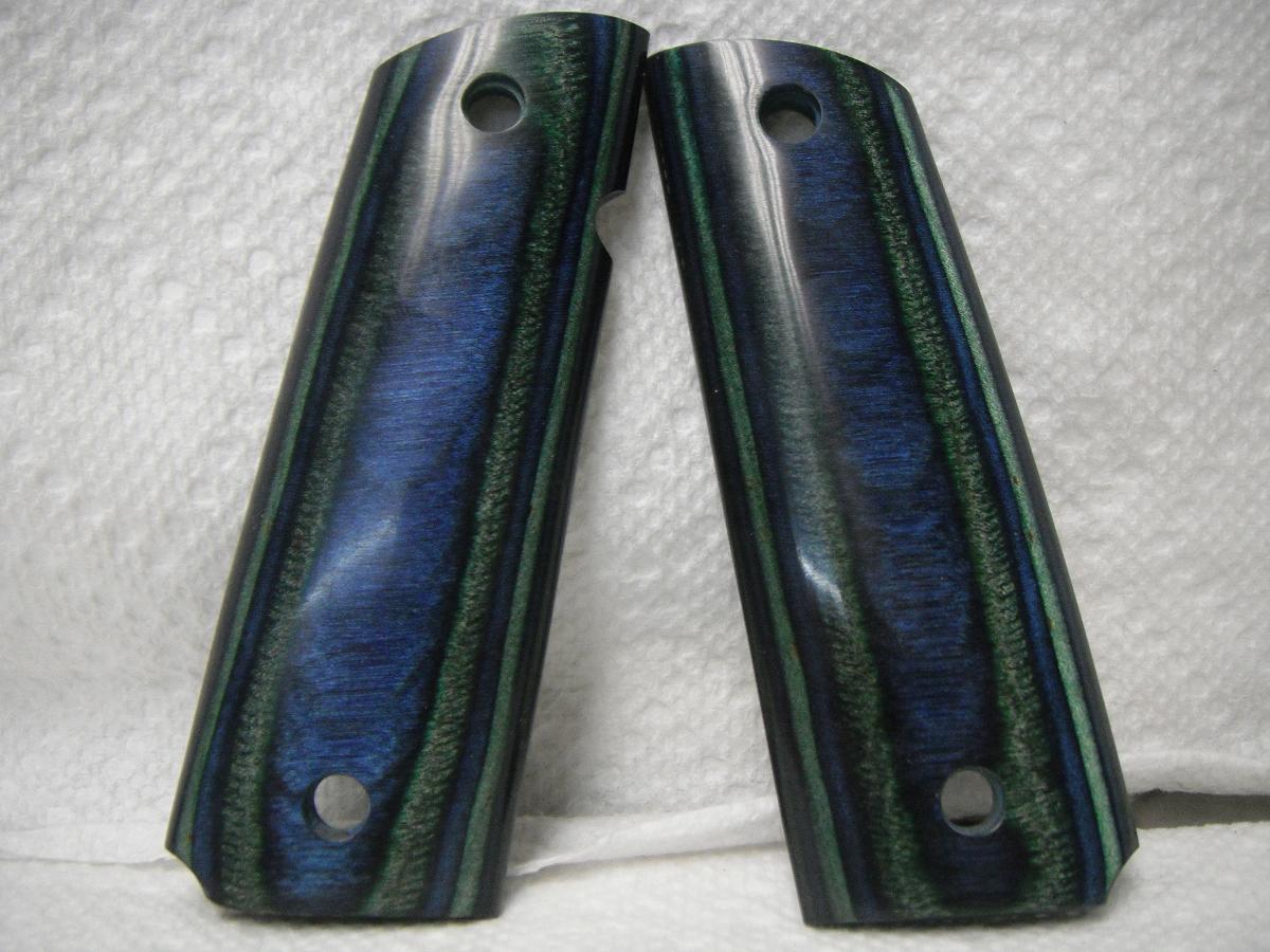 A pair of blue and green wood grips.