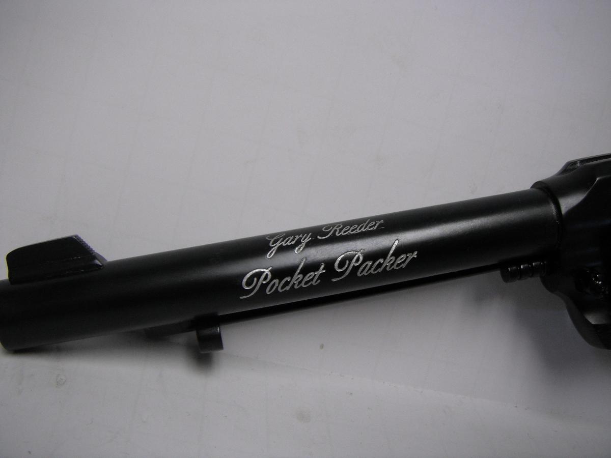 A black and silver pen with the words pocket packer written on it.