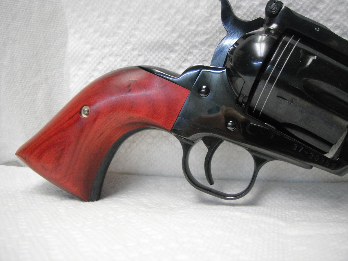 A gun that is sitting on top of the table.
