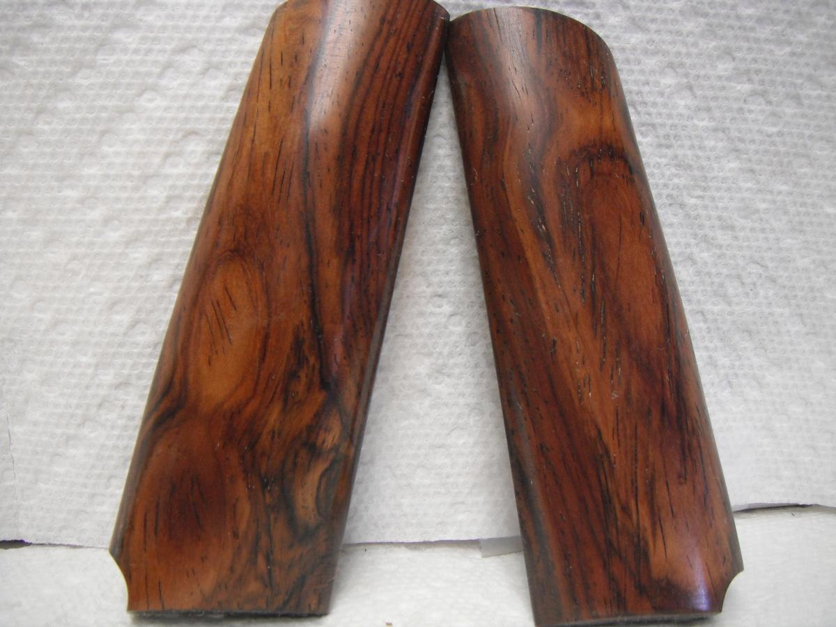 A pair of wooden handles on top of a table.