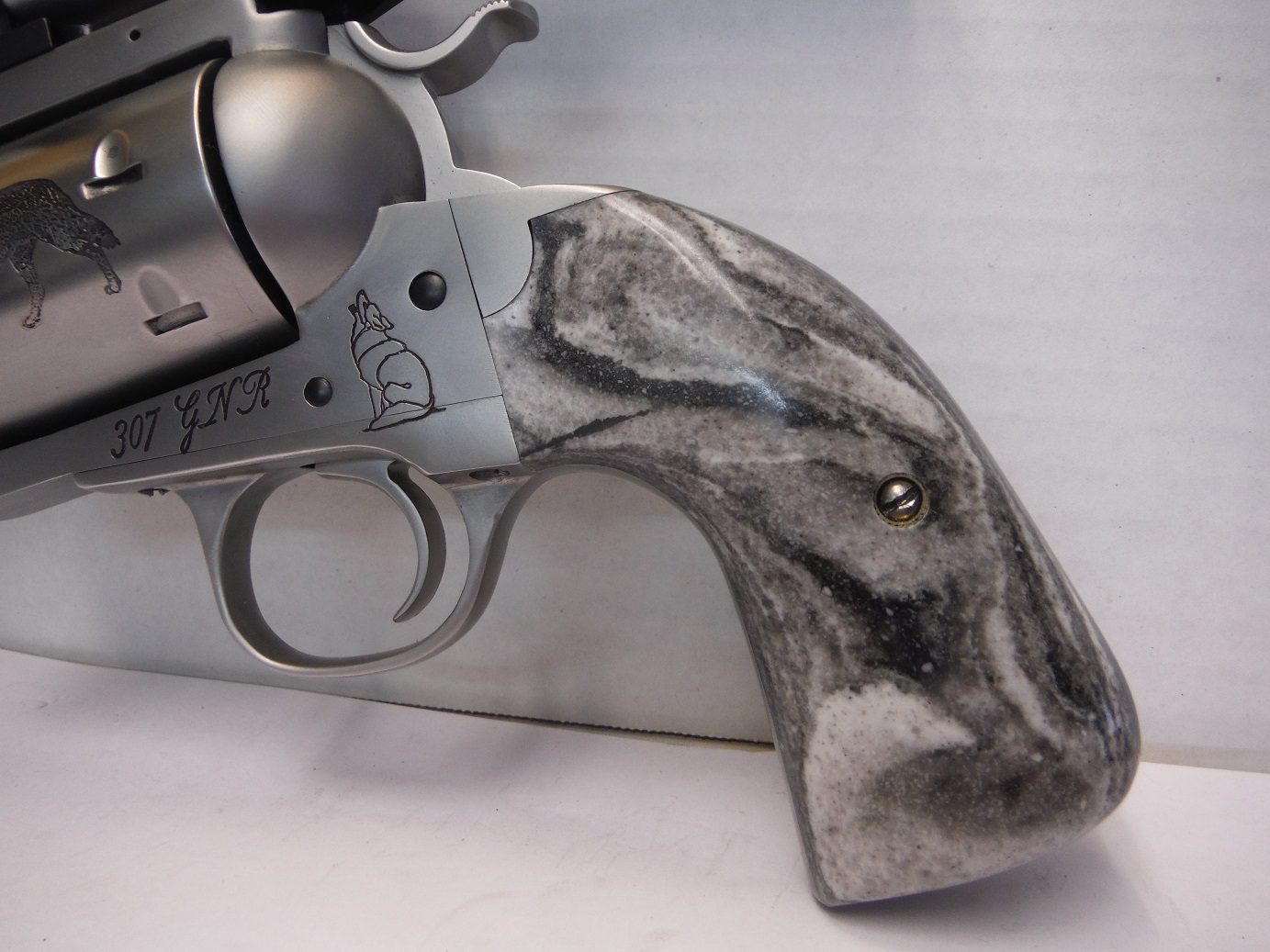 A gun that is sitting on top of a table.