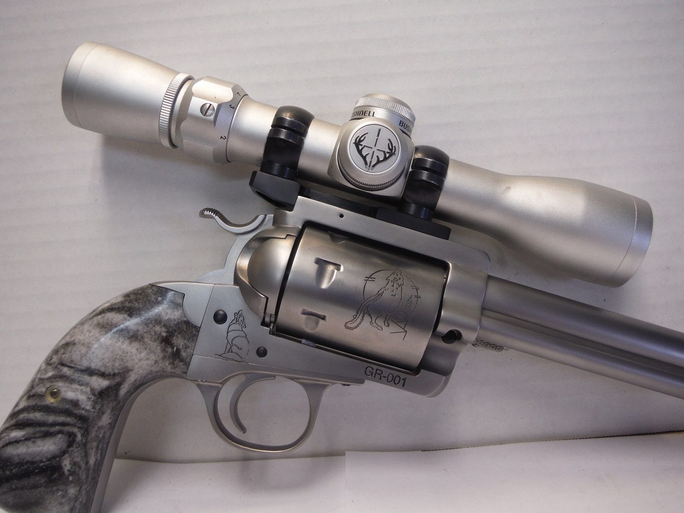 A gun with a scope attached to it