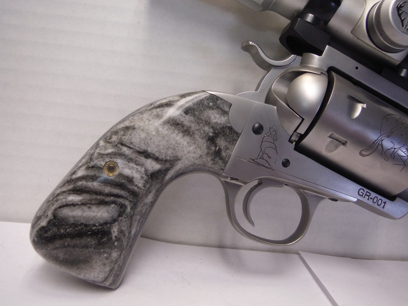 A gun that is sitting on the floor.