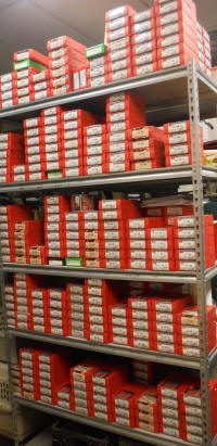 diesbr_small A large amount of shoes are stacked on top of each other.