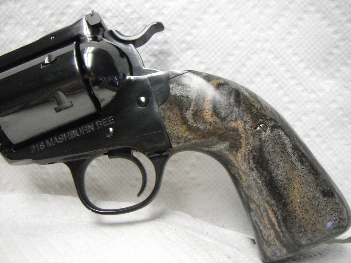 A gun that is sitting on top of a table.