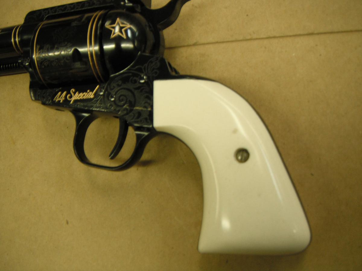 A white gun that is on the ground