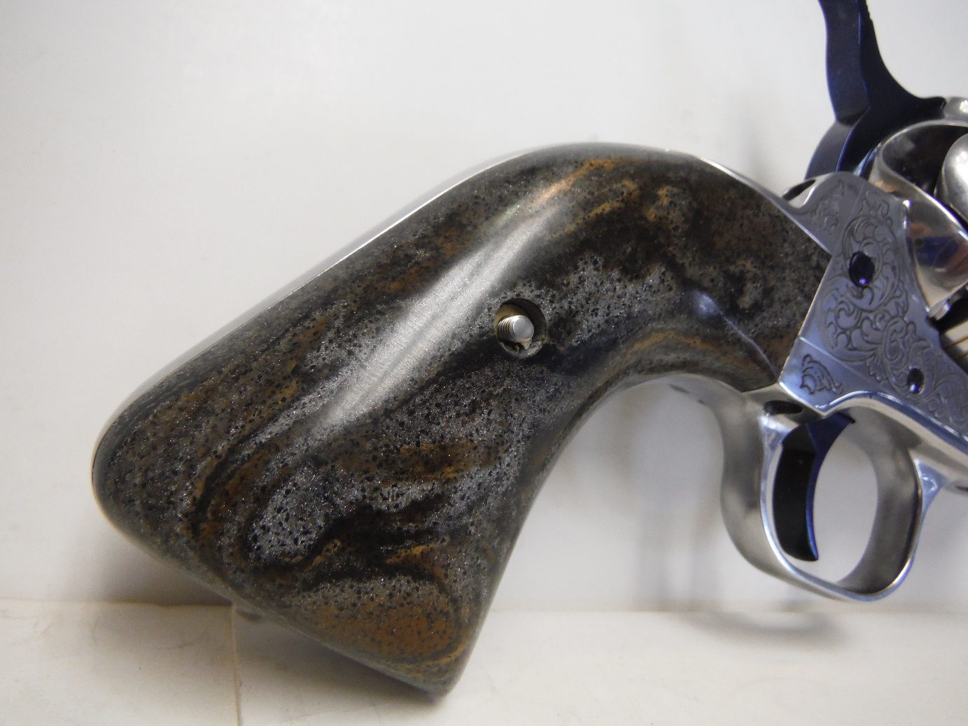 A gun that is laying on the ground.